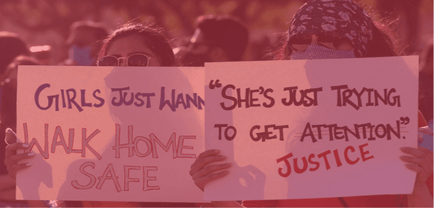 Image of two girls holding up banners